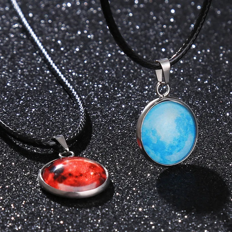 Luminous Christmas moon and starry night sky alloy pendant necklace with coloured glass centrepiece on a chain.