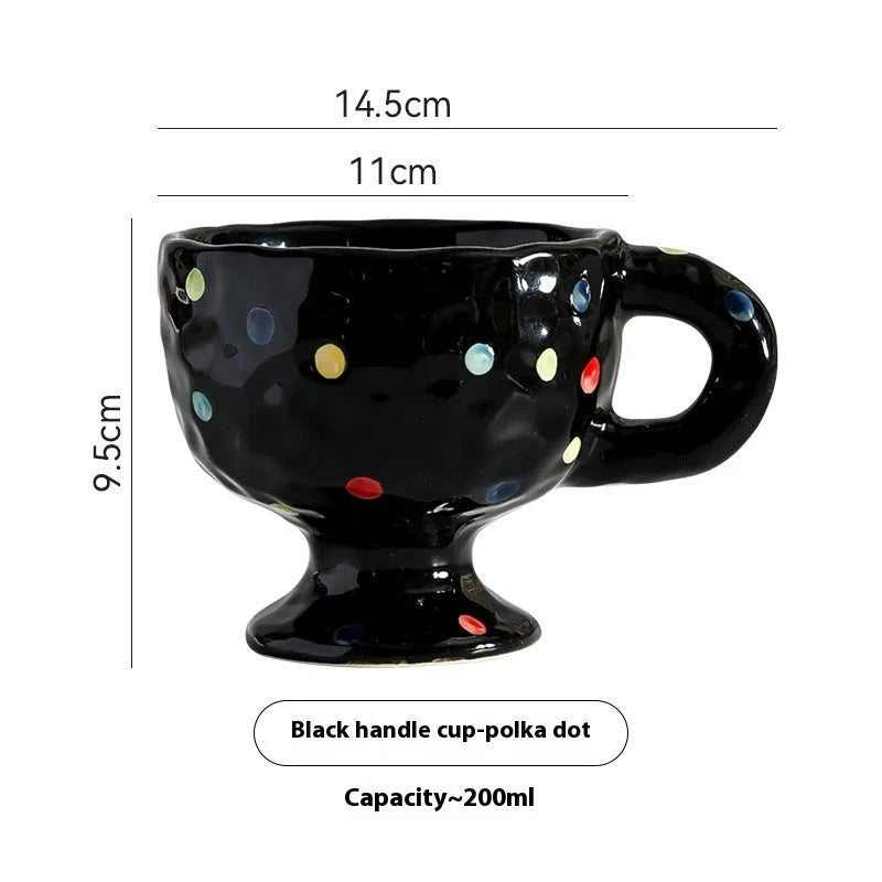 Irregularly shaped hand-pinched ceramic mug in a solid colour, shown on a plain background.