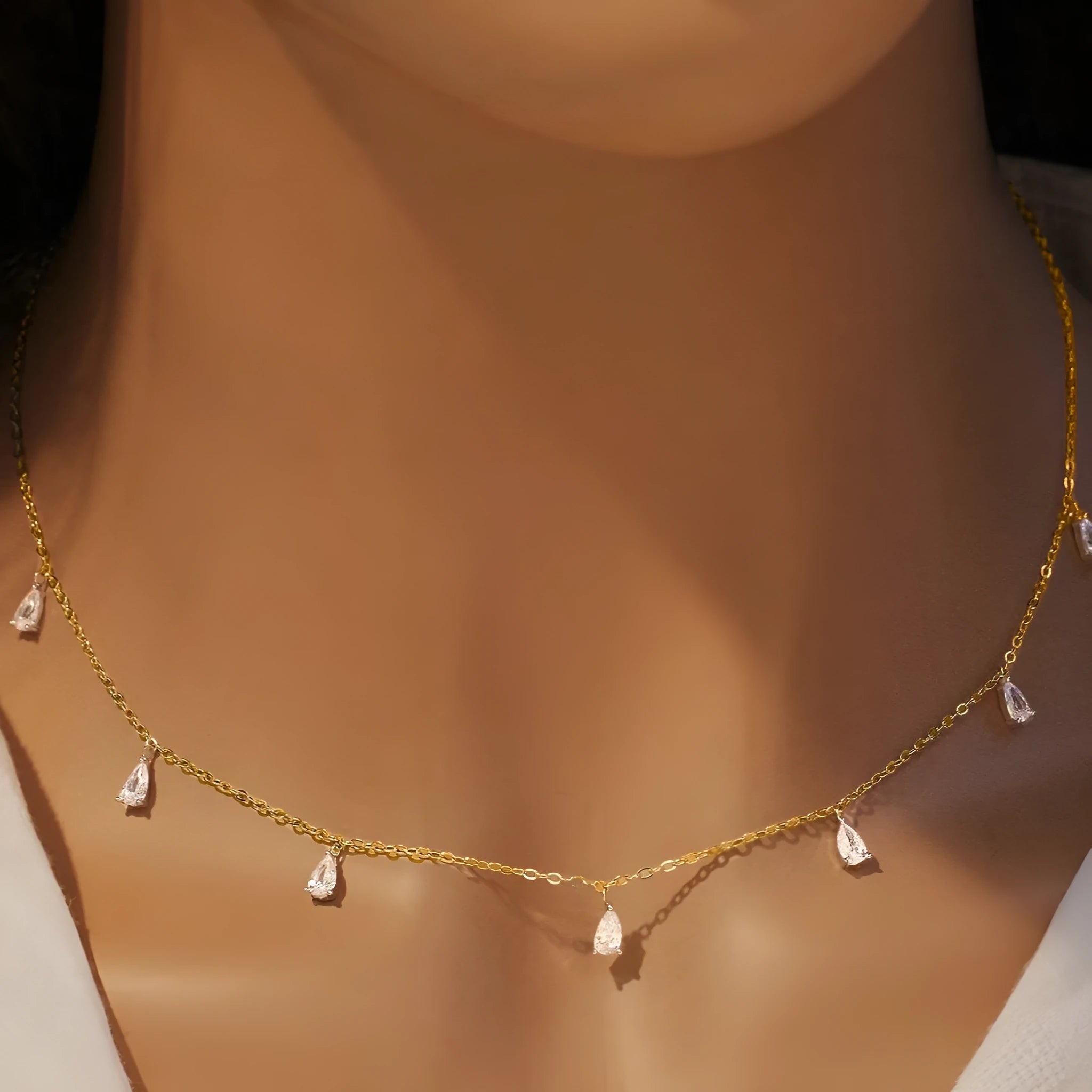 Gentle drop-shaped artificial zircon pendant on an adjustable 925 sterling silver O-chain necklace.