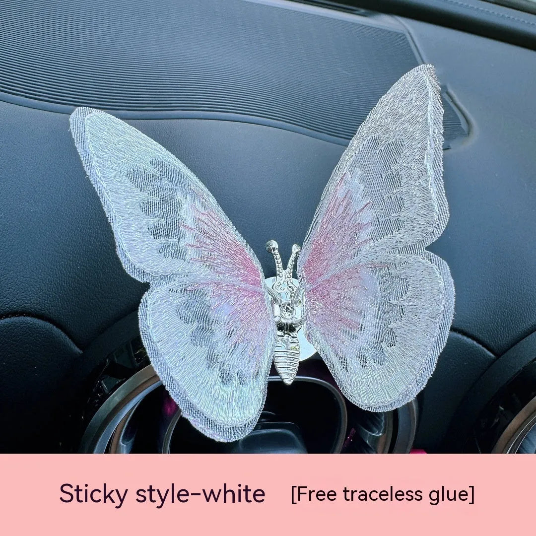 Fabric moving embroidery butterfly decoration for car centre console air vent in assorted colours.