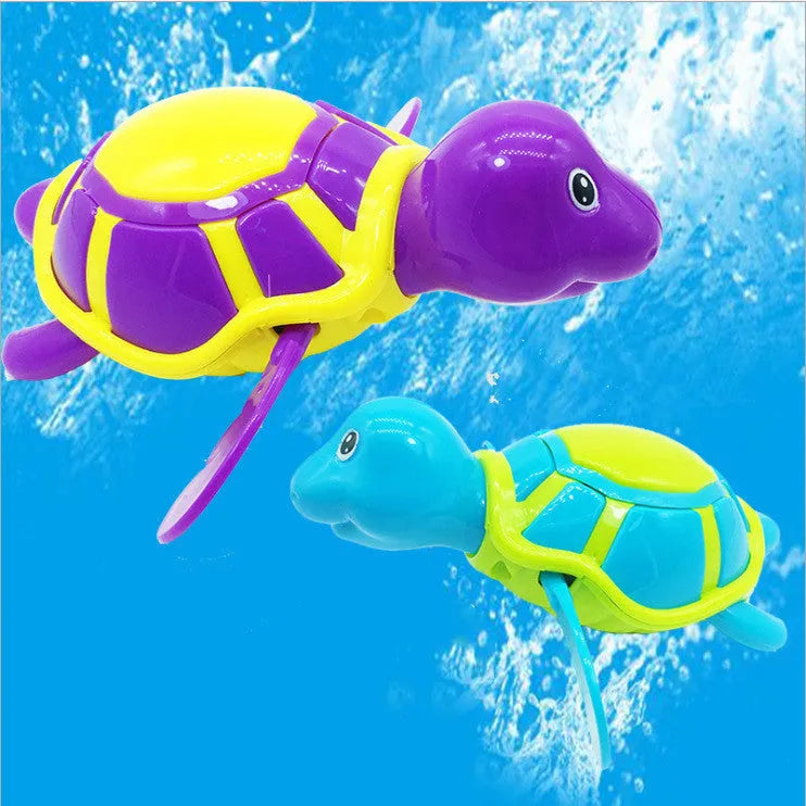 Plastic swimming turtle bath toy with brain game element for water play