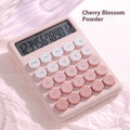 Gradient colour desktop calculator in violet, pink, blue, or green on a desk.