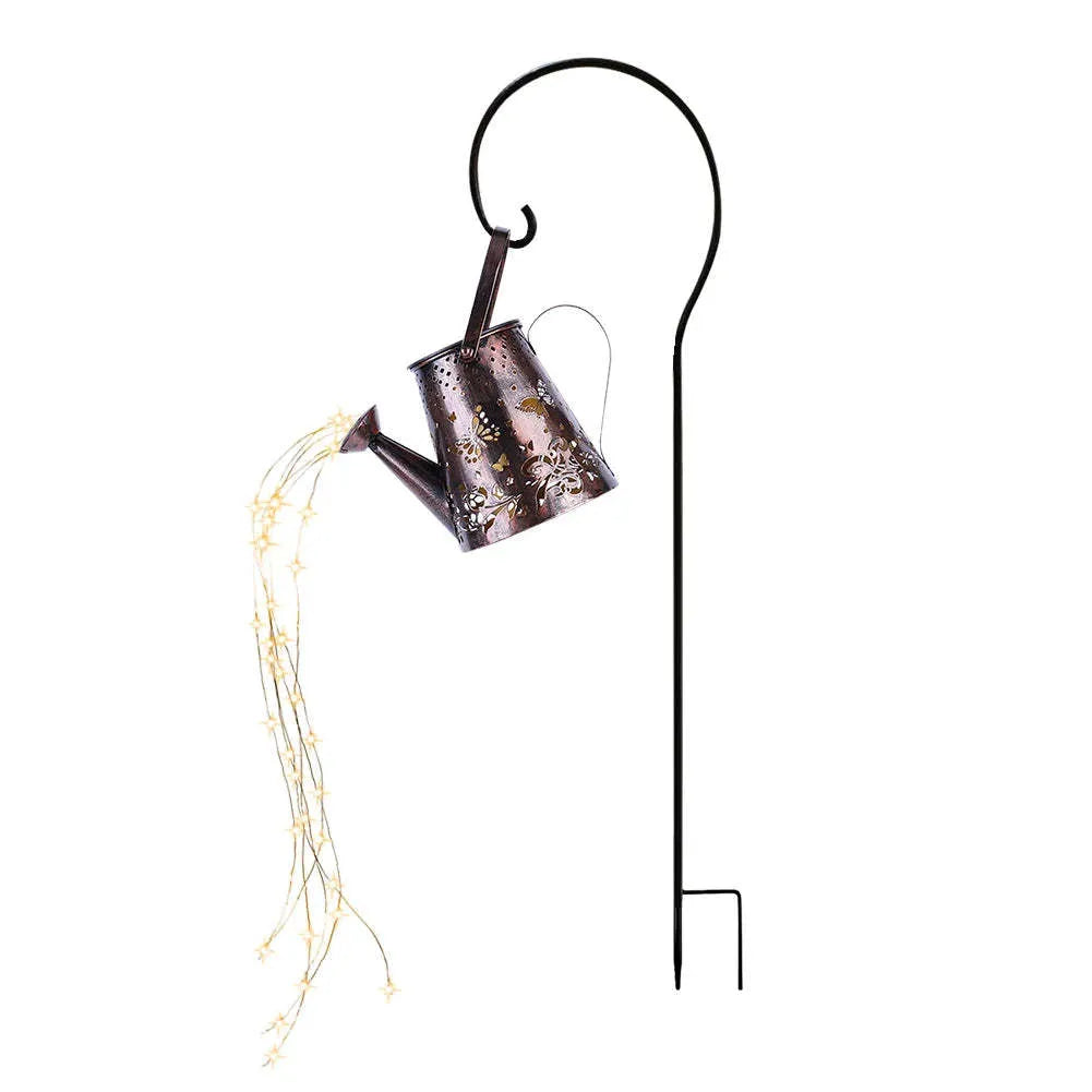 Tapered butterfly-shaped solar garden lantern made of iron, emitting a warm white light.