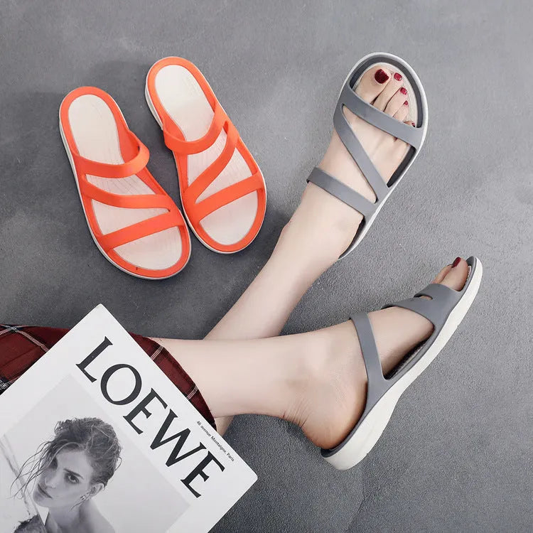 Women's casual sandals in red, made from breathable PP material, shown from the side.