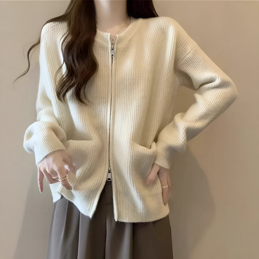 Soft beige viscose fibre sweater coat, a long-sleeve cardigan laid flat.