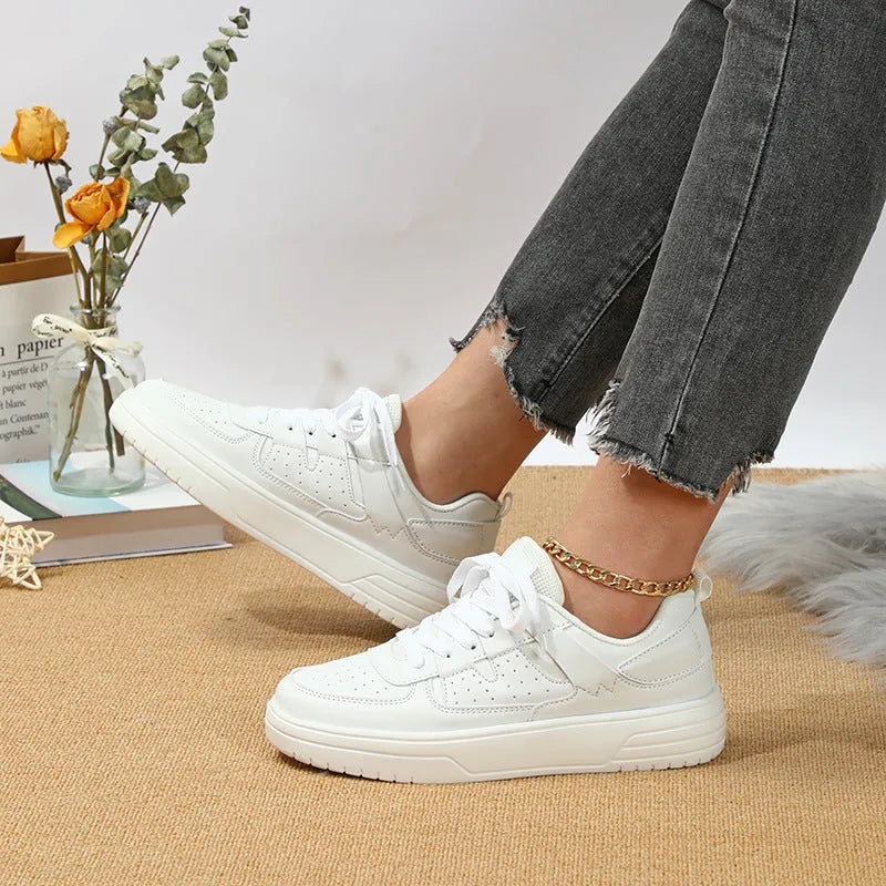 Pair of solid colour low heel lace-up board shoes with artificial PU upper and rubber sole
