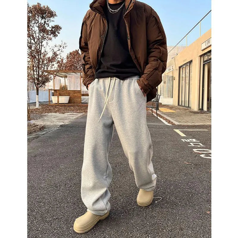 Men's casual sweatpants in black cotton loose fit with elastic waist and mid rise side view