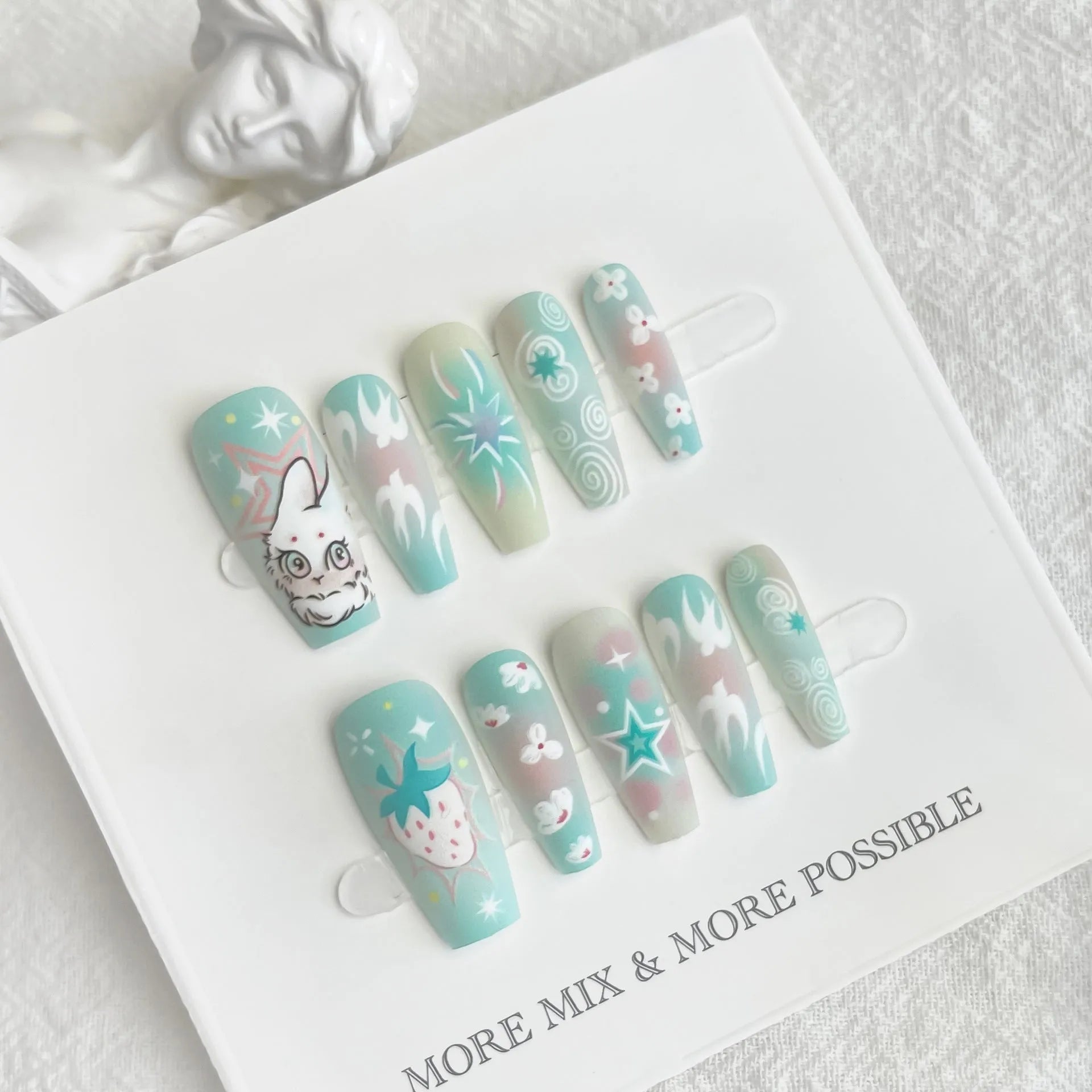 Cartoon cute rabbit middle ladder fake nails with cat's paw pattern in Rabbit Planet colour, including 40 pieces with frosted and glossy finish options