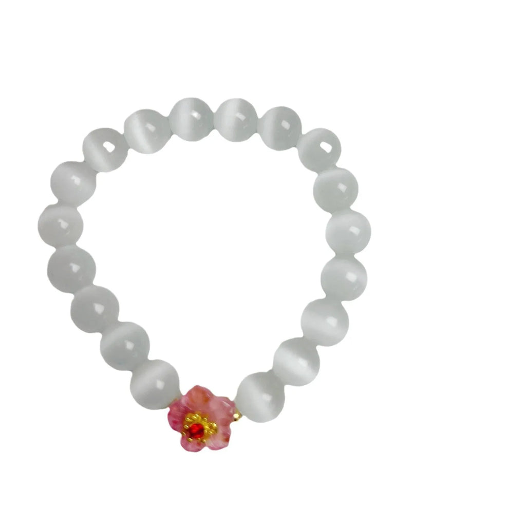 Women's handmade glass beaded bracelet with floral design in yellow, pink, white, or green colours