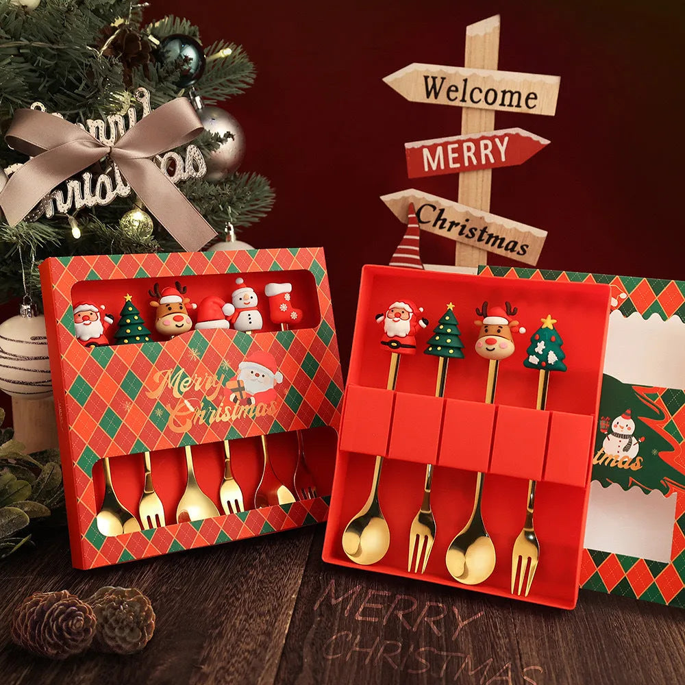 Red stainless steel Christmas spoon and fork set with festive handle designs including trees and snowmen