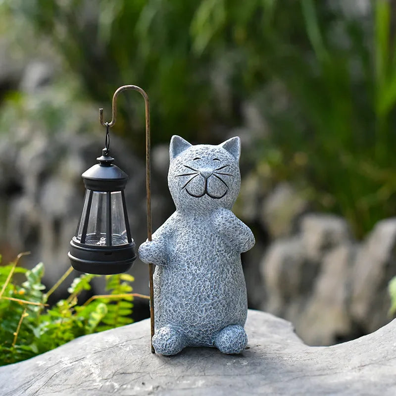 Solar-powered garden lamp with resin kitten ornament decoration for outdoor lighting