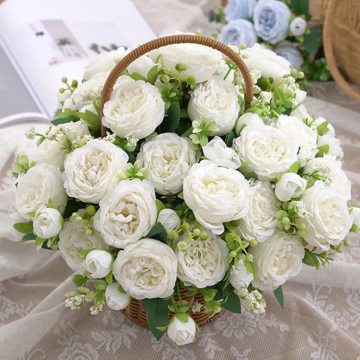 Artificial rose bouquet in pink beige champagne and light blue for wedding decoration, made from plastic and silk flower.