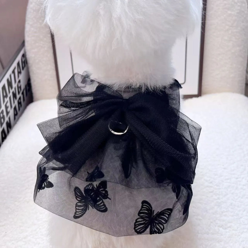 Black layered tulle princess skirt on a small dog, showing the full skirt silhouette and secure fit.