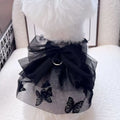 Black layered tulle princess skirt on a small dog, showing the full skirt silhouette and secure fit.