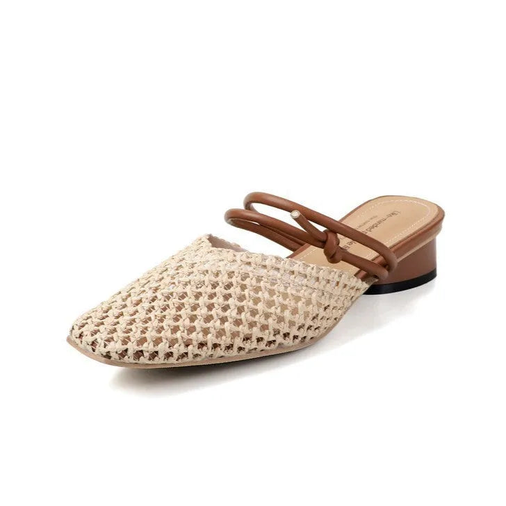 Women's beige square toe slippers with hollow-out design and a chunky mid-heel on a rubber sole.