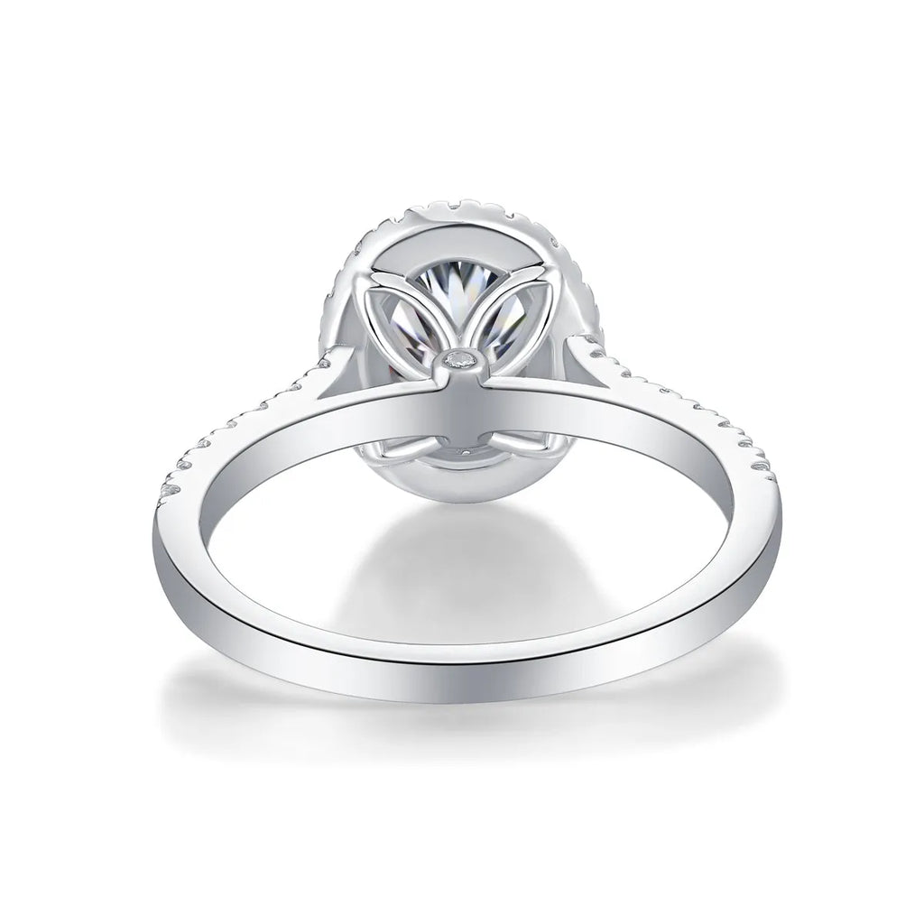 Audrey moissanite wedding ring set with egg-shaped 7x9mm stone in S925 silver platinum plating on white background