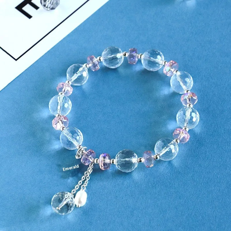White crystal bracelet with lucky cat charm and diamond-shaped XINGX crystal centrepiece