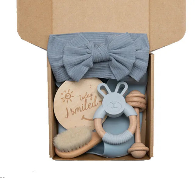 Newborn baby shower toy set with six bath toys in blue, peach, and brown options on a plain background