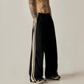 Black men's high-waisted wide-leg casual trousers laid flat.