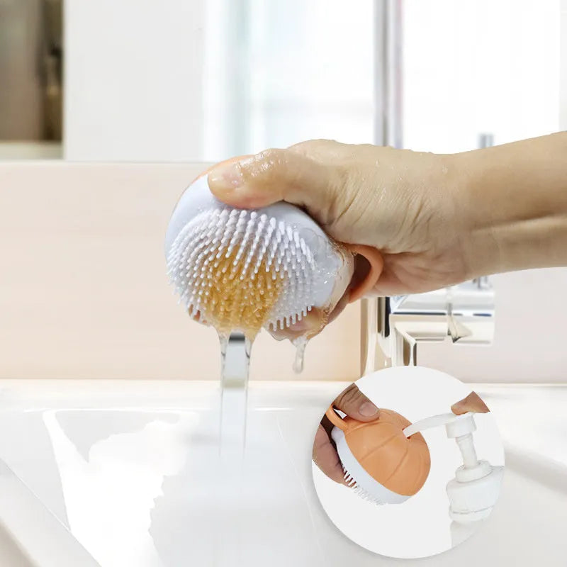 Orange silicone dog bath brush with shampoo dispenser and soft TPR bristles for pet grooming