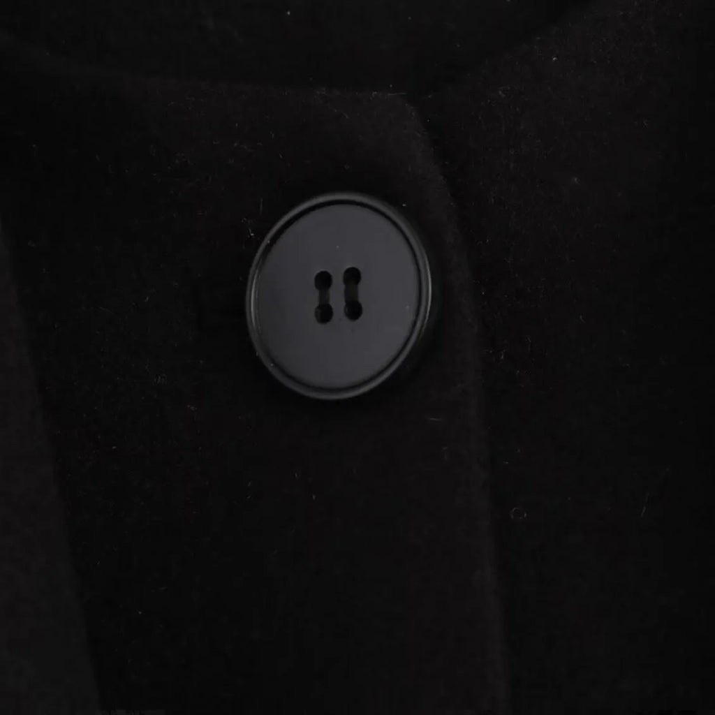Women's long black polyester overcoat with a detachable artificial fur collar in a street fashion style.