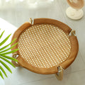 Brown woven rattan square pet hammock bed elevated off the ground.