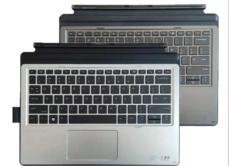 Elite X2 tablet sitting in the integrated base of a wireless keyboard with multimedia keys.