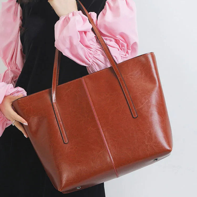 Women's genuine leather shoulder bag with retro styling and multiple internal compartments