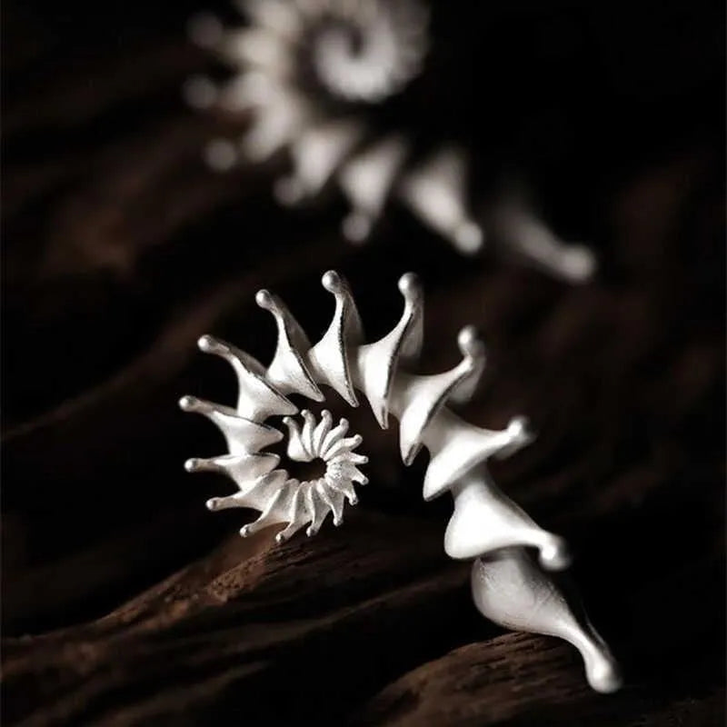 Three-dimensional matte conch stud earrings in alloy with irregular shape