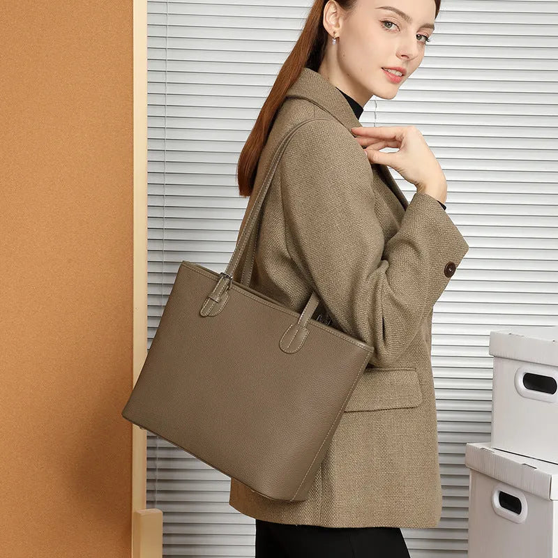 Genuine leather women's tote bag with multiple internal compartments showing document and phone pockets