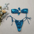 Glossy sapphire blue tube top split bikini with gold starfish decoration on a female model.
