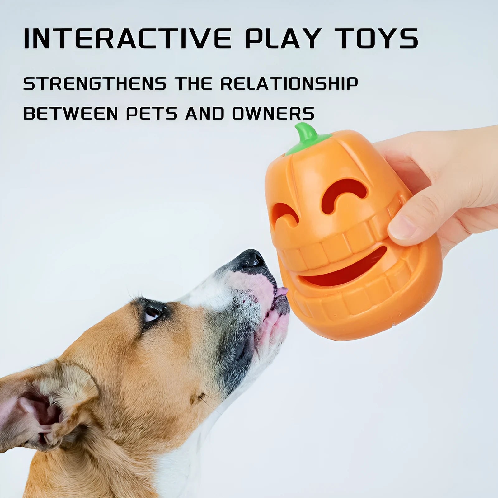 Orange Halloween pumpkin shaped rubber dog toy with a treat-dispensing funnel hole.