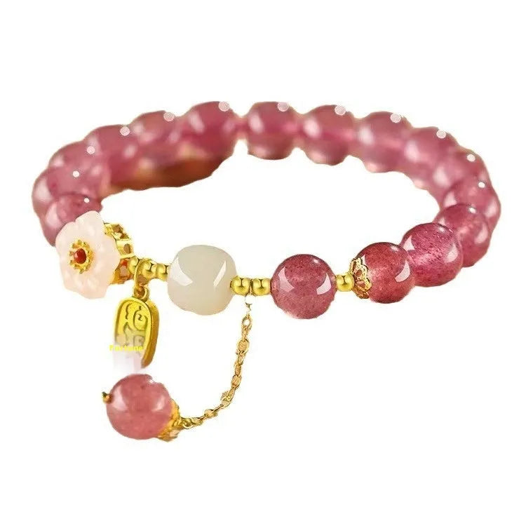 Handmade strawberry quartz crystal bracelet for women showing green strawberry quartz moon design.