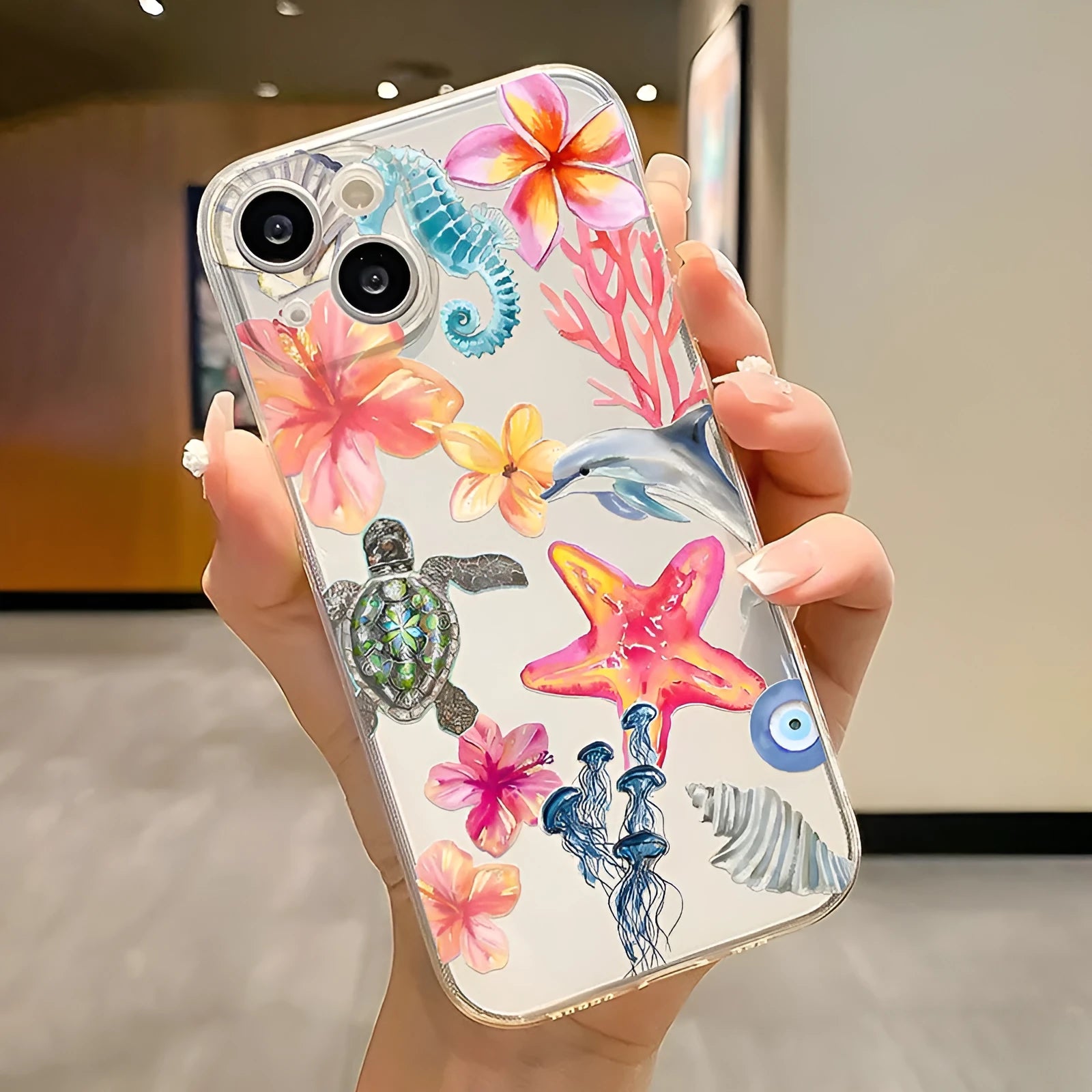 Transparent iPhone case with dolphin turtle design showing through clear TPU material