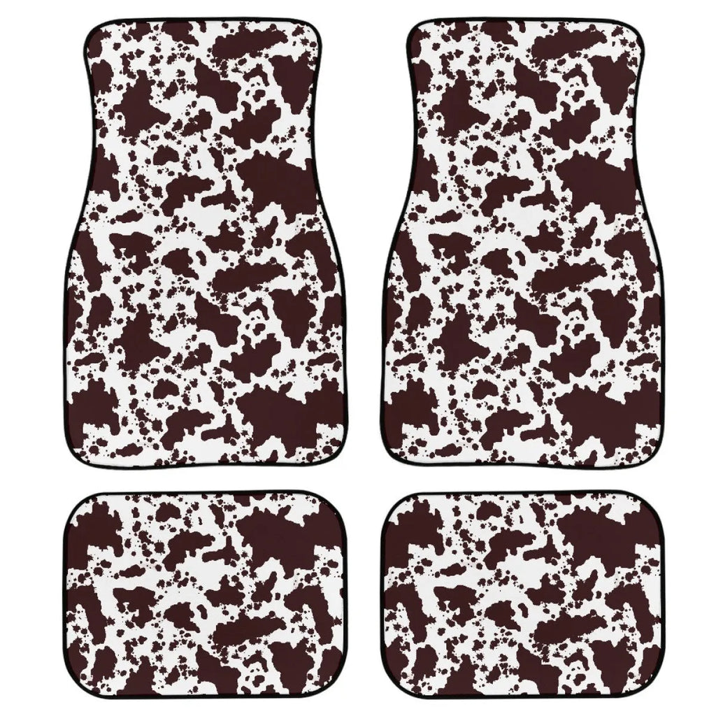 Set of four black printed rubber car floor mats with textured surface, shown on a car's footwell.