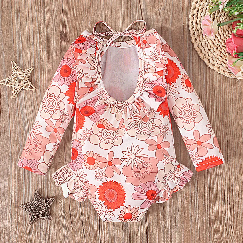 Girl's white floral print one-piece swimsuit with crew neck and open back design