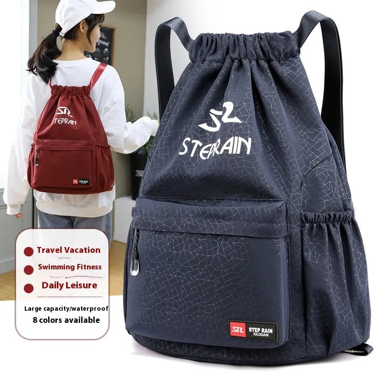 Lightweight solid colour Oxford cloth backpack with drawstring closure and double shoulder straps.