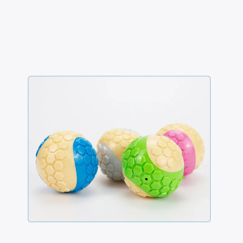 TPR plaid molar dog toy ball in blue, pink, green, and grey colours with textured surface