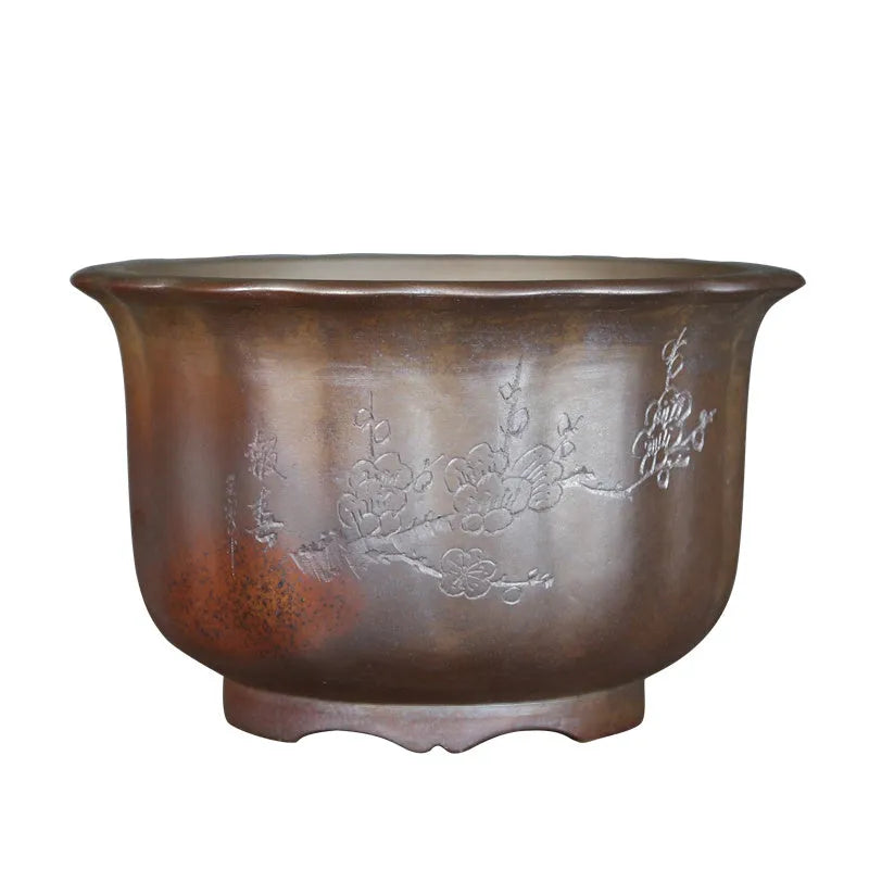 Antique carved wood burning finish on a purple sand ceramic bonsai flowerpot.