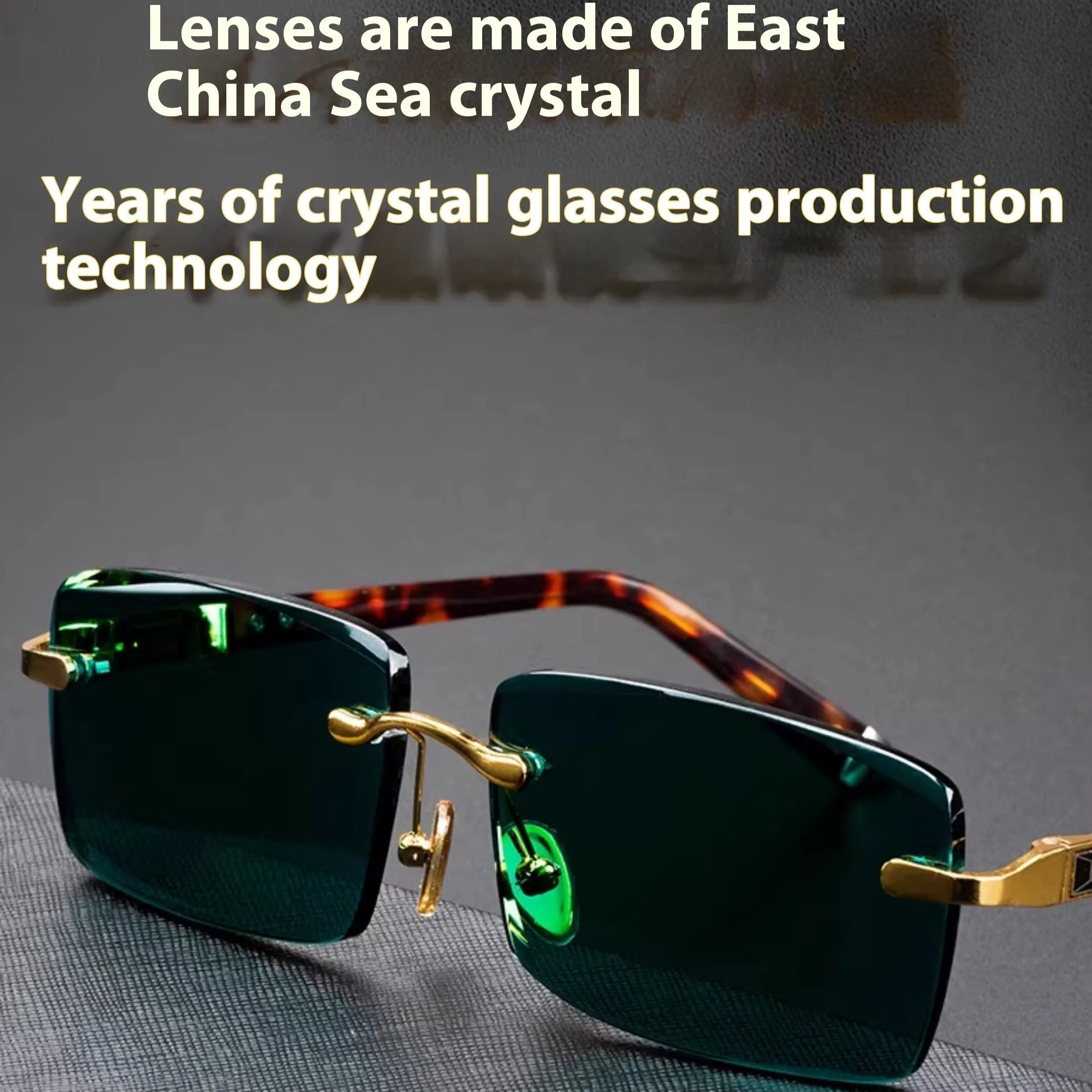 Frameless dark green crystal sunglasses with minimalist design on a case with cleaning cloth.
