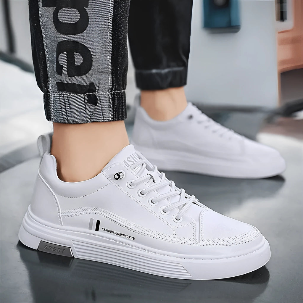 Men's white and black low-top skateboard shoes with an elastic band closure and round toe.