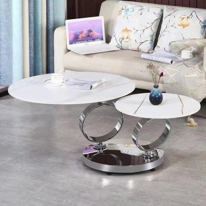 Round rotary folding table with slate top in black and white, set in a living room