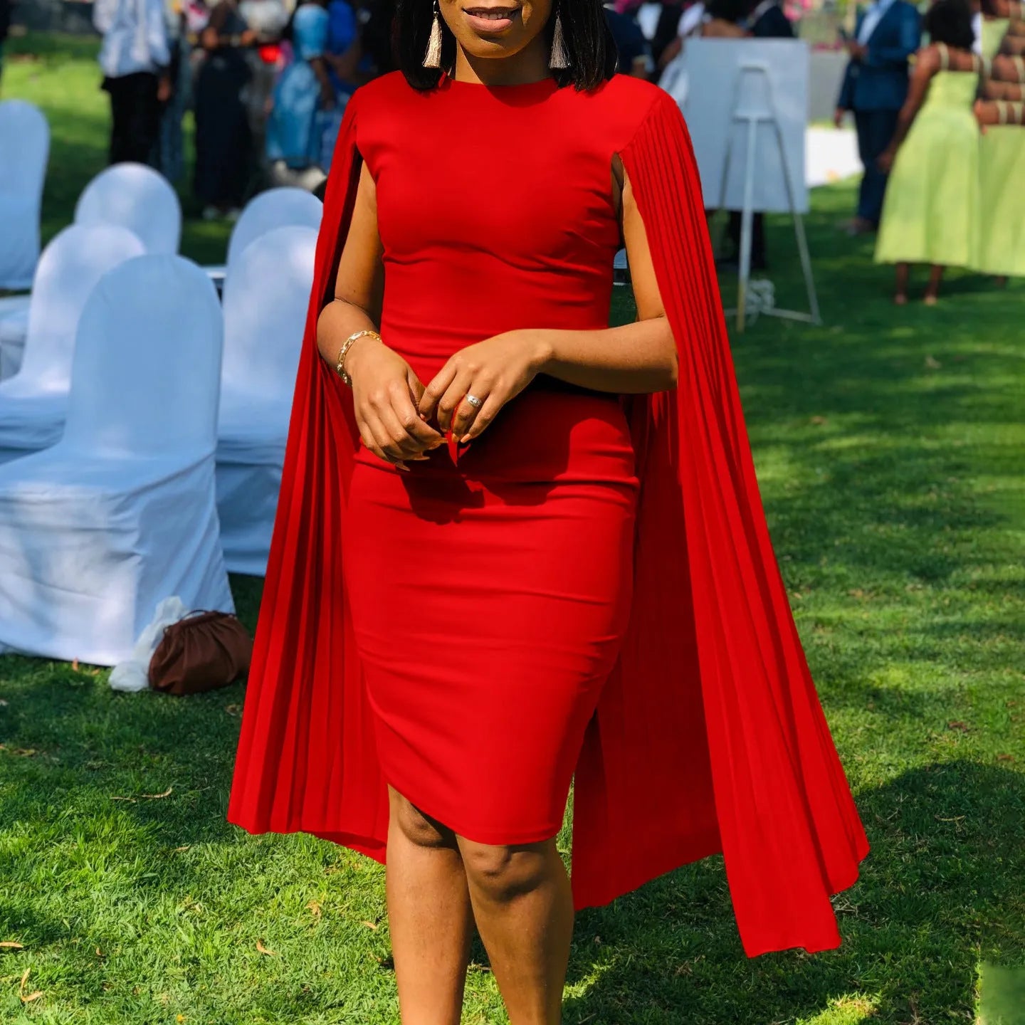 Women's long sleeve high-waist evening gown in a solid colour with a round neck and pleated shawl detail.