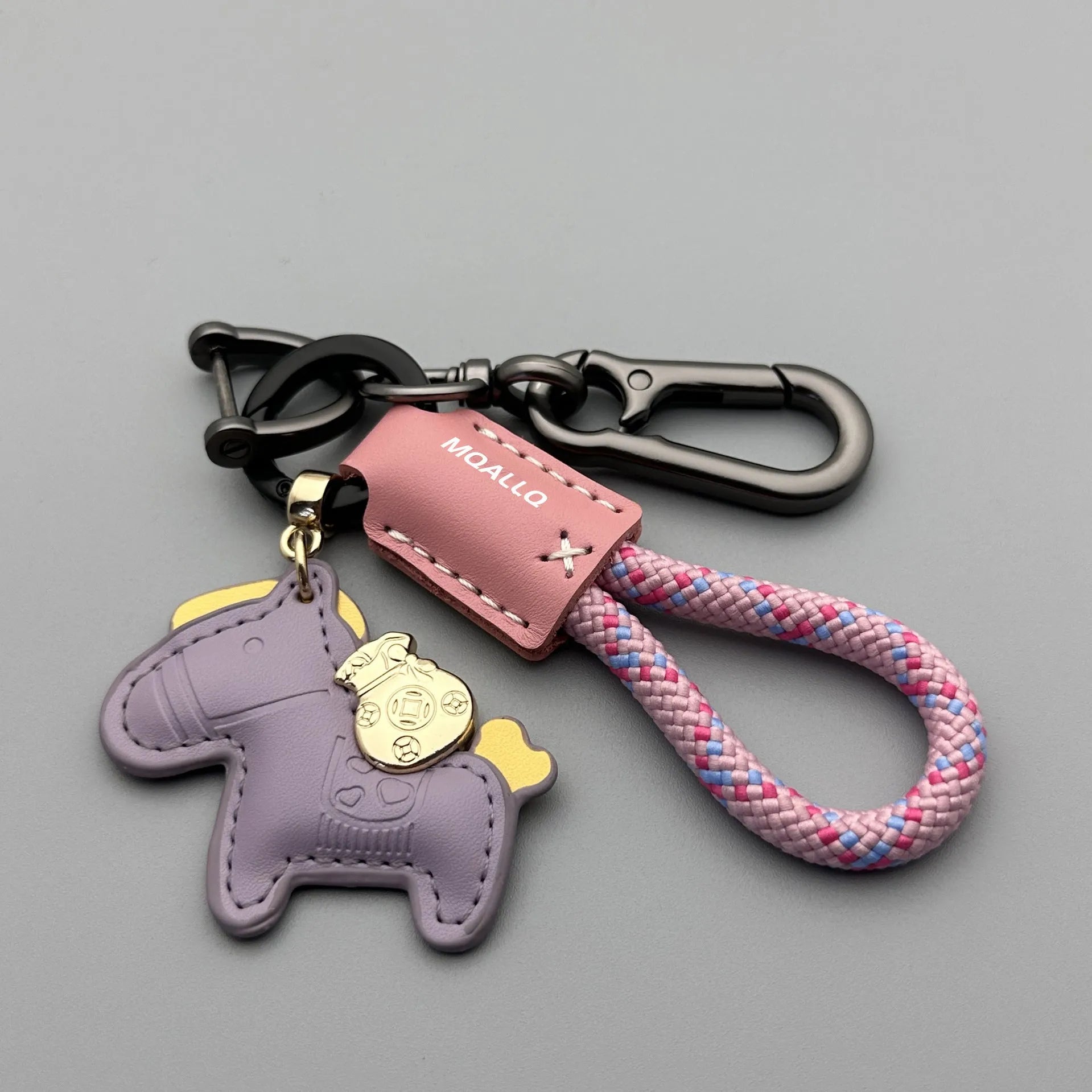 Handmade cowhide car key ring pendant with zinc alloy pony belt buckle on a colourful flanelle rope.