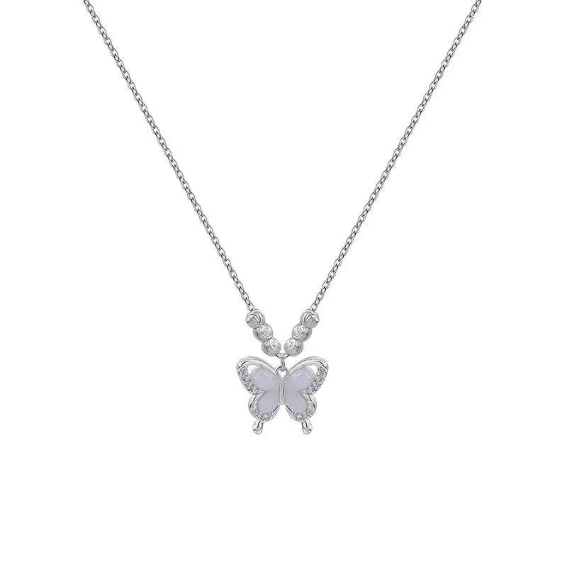 Women's silver butterfly and opal pendant necklace on a cross chain, adjustable from 41cm to 50cm.