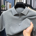 Man wearing a loose grey cotton short sleeve pullover sweater for casual leisure wear.