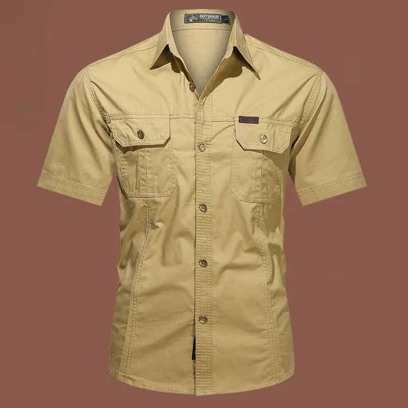 Men's loose beige cotton short sleeve cardigan-style work shirt on a hanger.