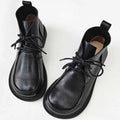 Big Toe women's pure leather ankle boots in black, low tube, rubber sole, hollow out details