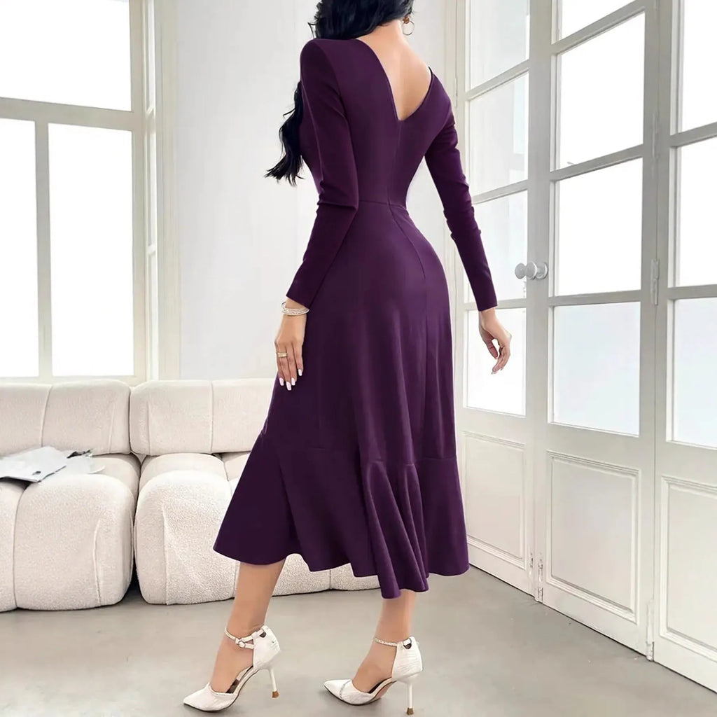 Purple women's long sleeve dress with ruffle detail and a round neck.