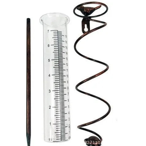 Cast iron hummingbird-shaped rain gauge with glass measurement tube showing 0-800ml capacity scale